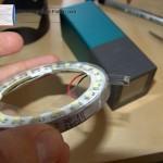 Make a series of overlapping pieces of adhesive tape (width ~ 10 mm) all around the outer edge to secure the plastic layer. 